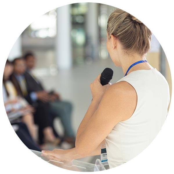 A woman speaking at a business meeting