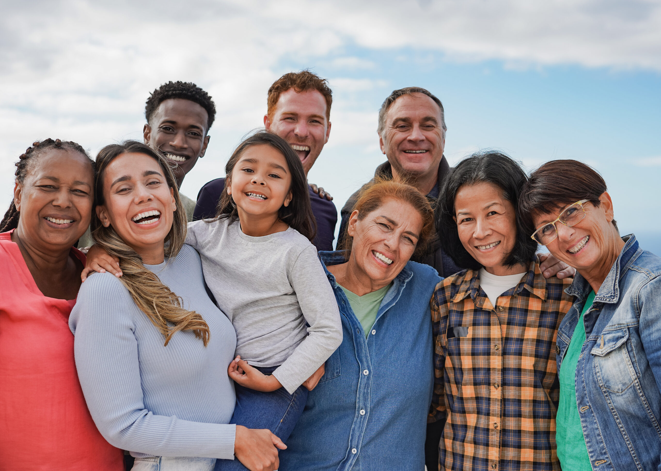 Multi generational friends smiling on camera outdoor – Group of